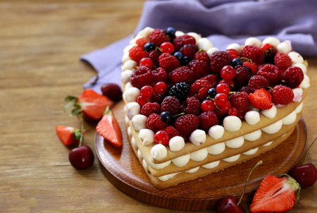 festive cake with cream and fresh berriesの写真素材