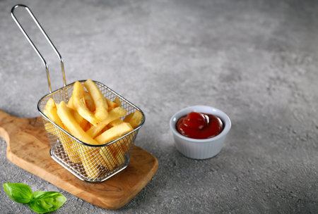 snack french fries with ketchup on the table