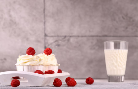 vanilla cupcakes with fresh berries for dessertの写真素材