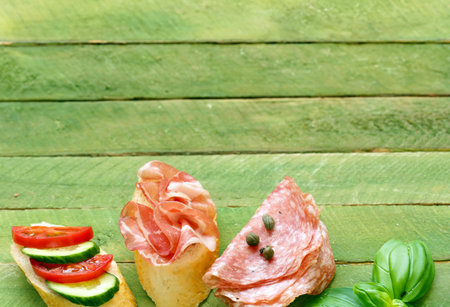 bruschetta sandwiches with ham and vegetables in Italian styleの写真素材