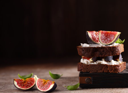 rye bread toast with figs and cream cheeseの写真素材