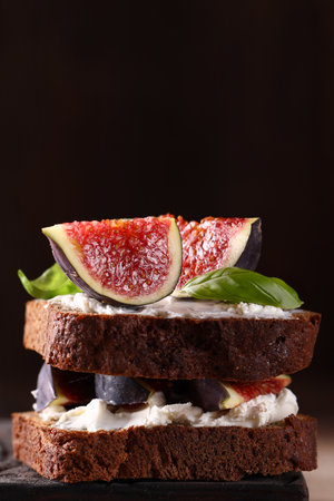 rye bread toast with figs and cream cheeseの写真素材
