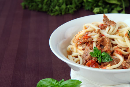 traditional dish lagman noodles with vegetables and meatの写真素材