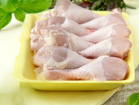 raw chicken meat with herbs and spicesの写真素材