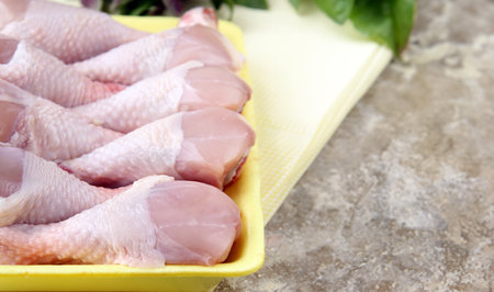 raw chicken meat with herbs and spicesの写真素材