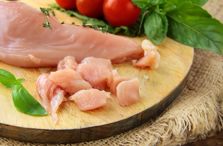raw chicken meat with herbs and spicesの写真素材