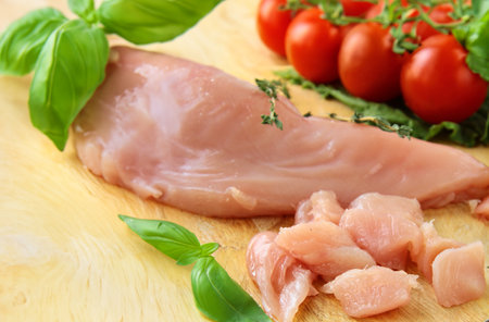 raw chicken meat with herbs and spicesの写真素材