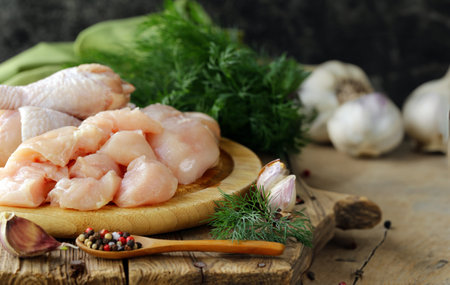 raw chicken meat with herbs and spicesの写真素材