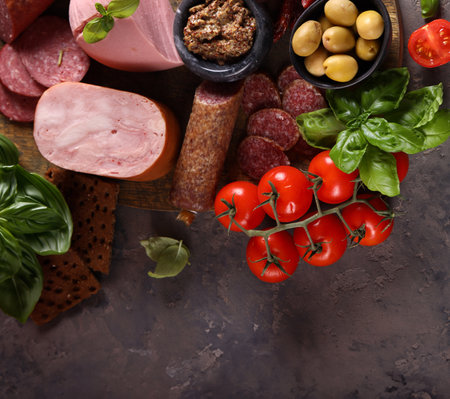 assorted sausages and deli meats for appetizersの写真素材