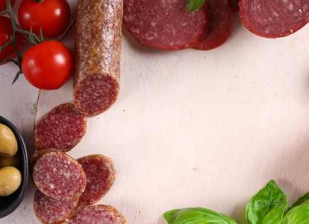 assorted sausages and deli meats for appetizersの写真素材