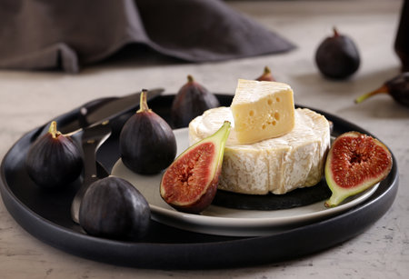 soft brie camembert cheese on a plateの写真素材
