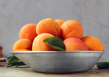 organic ripe apricots peaches on the tableの写真素材