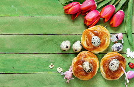 Easter buns and traditional eggs on wooden backgroundの写真素材