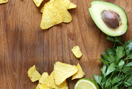 traditional guacamole sauce with avocado and nacho chipsの写真素材