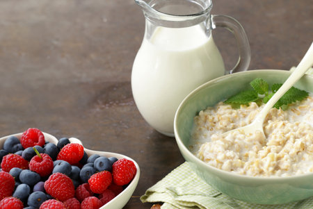 healthy breakfast with whole grain porridge and fresh berriesの写真素材