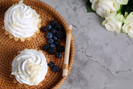 mini cake basket with meringue creamの写真素材