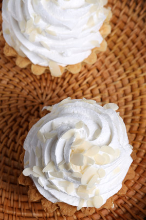 mini cake basket with meringue creamの写真素材