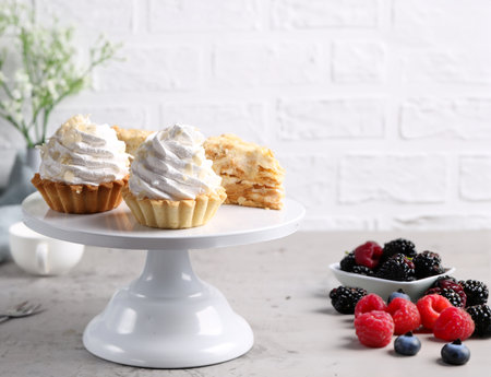 mini cake basket with meringue creamの写真素材