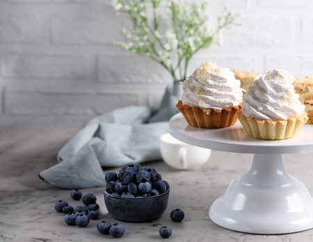 mini cake basket with meringue creamの写真素材