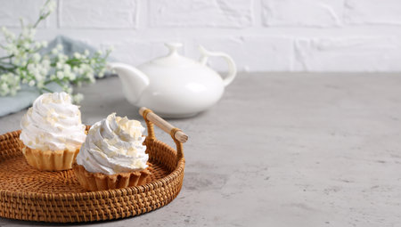 mini cake basket with meringue creamの写真素材