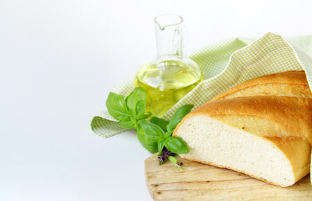 white bread loaf on a wooden tableの写真素材