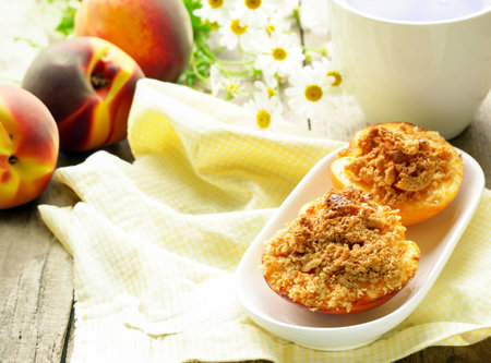 dessert baked peaches with nuts and ice creamの写真素材