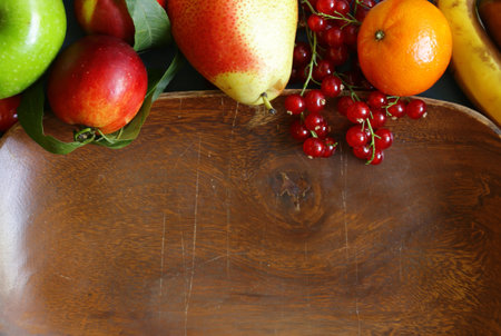 berries and fruits on wooden food backgroundの写真素材