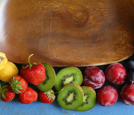 berries and fruits on wooden food backgroundの写真素材