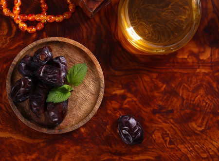 organic natural dried dates in a wooden plateの写真素材
