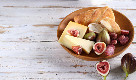 baguette with cheese and fresh fruit for snackの写真素材