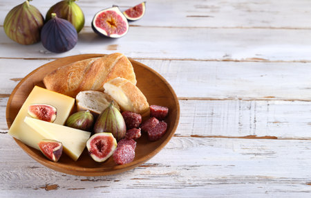 baguette with cheese and fresh fruit for snackの写真素材