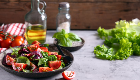fresh salad with cherry tomatoes and basilの写真素材