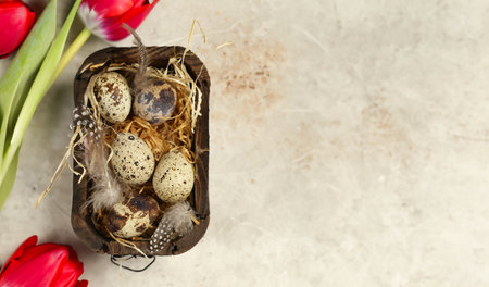 Easter composition with quail eggs and flowers