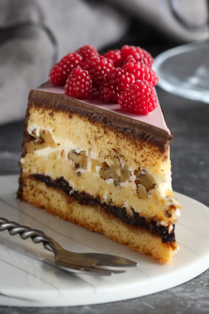 piece of cake on a plate with fresh berries for dessert
