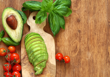 fresh organic avocado sliced on a board