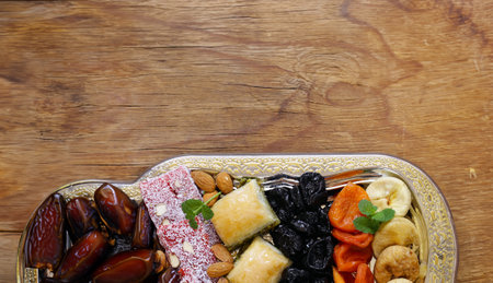 assortment of dried fruits figs dried apricots and dates and Turkish delightの写真素材