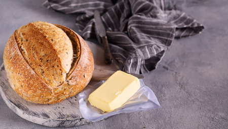 homemade tartine bread with milk and butterの写真素材