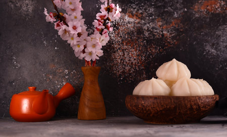 tea ceremony green tea with sakura branchesの写真素材