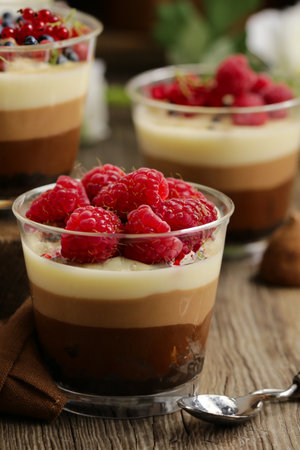 jelly dessert in a glass with fresh berriesの写真素材