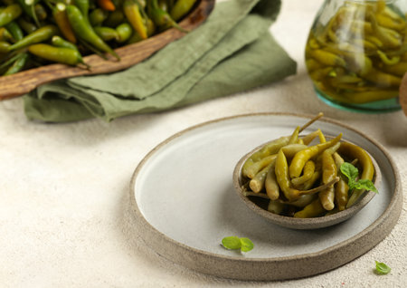 spicy pickled green jalapeno peppersの写真素材