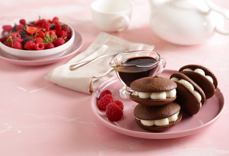 whoopie pie cookies with buttercream and berriesの写真素材