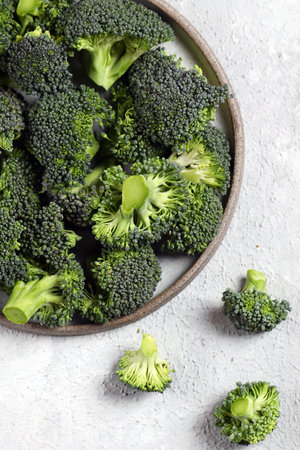 fresh organic broccoli in a bowl for healthy eatingの写真素材