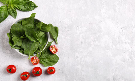 fresh organic spinach in a bowl for healthy eatingの写真素材