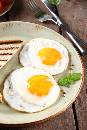 traditional breakfast with eggs salad and toastの写真素材