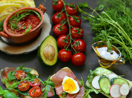 sandwiches with different fillings - vegetables, ham and eggの写真素材