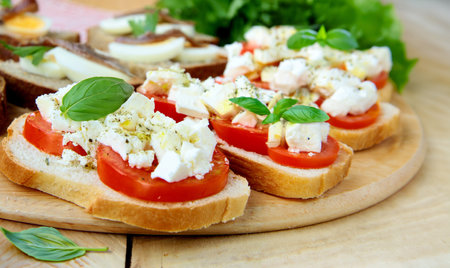 Italian traditional bruschetta with tomatoes and cheeseの写真素材