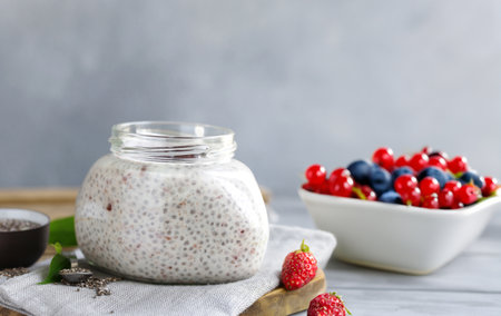chia pudding in a jar with fresh berriesの写真素材