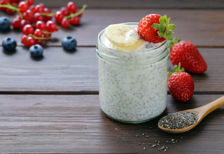 chia pudding in a jar with fresh berriesの写真素材