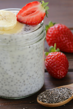 chia pudding in a jar with fresh berriesの写真素材