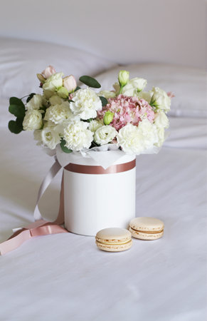 delightful bouquet of white and pink colors in a gift boxの写真素材